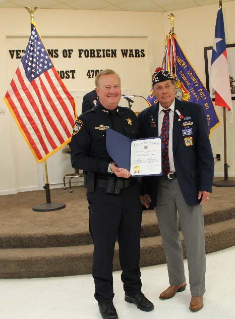 Photo of Sheriff Rand Henderson receiving recognition from VFW Post Commander